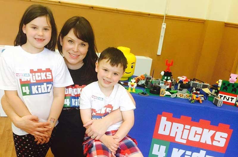 Franchise owner Caroline Cobb with children at a Bricks 4 Kidz event